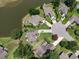 Aerial view of the real estate showcasing its premium location near a lake and other well-maintained homes at 1409 Ashwood Circle, Surfside Beach, SC 29575