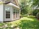 Well-maintained backyard featuring lush green grass, providing a serene outdoor space for relaxation and recreation at 1409 Ashwood Circle, Surfside Beach, SC 29575