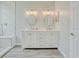 Bathroom featuring a double vanity with soft-close cabinets, quartz countertops, and wood-look tiled floors at 1409 Ashwood Circle, Surfside Beach, SC 29575
