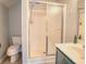 Bathroom featuring a single vanity, a shower, and a toilet at 1409 Ashwood Circle, Surfside Beach, SC 29575