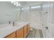 Bathroom featuring a single vanity, a window, and a shower-tub combo at 1409 Ashwood Circle, Surfside Beach, SC 29575