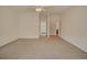Spacious bedroom with neutral walls and carpet, offering seamless access to the bathroom and hallway at 1409 Ashwood Circle, Surfside Beach, SC 29575
