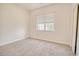 Neutral bedroom featuring plush carpet and a window with blinds at 1409 Ashwood Circle, Surfside Beach, SC 29575