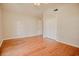 Bright bedroom featuring hardwood floors, a closet, and a white ceiling fan at 1409 Ashwood Circle, Surfside Beach, SC 29575