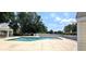Community pool with chairs, ladders and meticulously maintained landscaping at 1409 Ashwood Circle, Surfside Beach, SC 29575