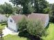 Aerial view of the house showcasing its beautiful lawn, roof, and ample parking space at 1409 Ashwood Circle, Surfside Beach, SC 29575