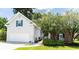 Charming home featuring a two-car garage, brick accents, and mature landscaping, offering great curb appeal at 1409 Ashwood Circle, Surfside Beach, SC 29575