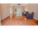 Spacious living room featuring hardwood floors and bright windows with backyard views at 1409 Ashwood Circle, Surfside Beach, SC 29575