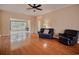 Cozy living room featuring hardwood floors, comfortable seating, and neutral wall colors for a welcoming ambiance at 1409 Ashwood Circle, Surfside Beach, SC 29575