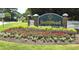 Community sign showcasing beautiful flower beds and landscaping with the community name at 1409 Ashwood Circle, Surfside Beach, SC 29575