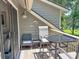 Charming outdoor seating on a private balcony, perfect for enjoying waterfront views and relaxing outdoors at 145 Hartland Dr. # 4-E, Myrtle Beach, SC 29572