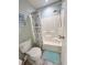 Clean bathroom with a shower/tub combo, seashell-themed shower curtain, and matching floor mat at 145 Hartland Dr. # 4-E, Myrtle Beach, SC 29572