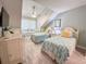 Bedroom features three twin beds, a ceiling fan, and a window at 145 Hartland Dr. # 4-E, Myrtle Beach, SC 29572