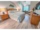 Bedroom with blue-themed decor, a desk, a window, and wood-style flooring at 145 Hartland Dr. # 4-E, Myrtle Beach, SC 29572
