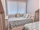 Charming bedroom featuring twin beds with seahorse-themed bedding and ample natural light at 145 Hartland Dr. # 4-E, Myrtle Beach, SC 29572