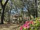 Picturesque gazebo nestled among lush greenery, offering a tranquil spot for relaxation and enjoyment of nature at 145 Hartland Dr. # 4-E, Myrtle Beach, SC 29572