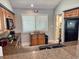Cozy kitchen featuring wood cabinets, granite counters, and stainless-steel appliances at 145 Hartland Dr. # 4-E, Myrtle Beach, SC 29572