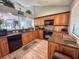 Well-lit kitchen with stainless-steel appliances, wood cabinets, and wood-style flooring at 145 Hartland Dr. # 4-E, Myrtle Beach, SC 29572