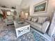 Comfortable living room with neutral decor, plush seating, and seamless flow into the open kitchen at 145 Hartland Dr. # 4-E, Myrtle Beach, SC 29572