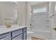 Bathroom with shower and blue vanity at 1534 Breakwater Dr., Little River, SC 29566