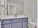 Bathroom with a modern vanity, quartz countertop, and a large mirror at 1534 Breakwater Dr., Little River, SC 29566