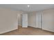 Neutral bedroom featuring carpet floor, white trim, and two doors at 1534 Breakwater Dr., Little River, SC 29566