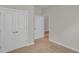 Bedroom with closet and open door at 1534 Breakwater Dr., Little River, SC 29566