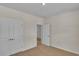 Neutral bedroom featuring carpet floor, white trim, and a double door closet at 1534 Breakwater Dr., Little River, SC 29566