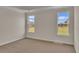 Bedroom with tray ceiling and backyard view at 1534 Breakwater Dr., Little River, SC 29566