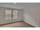 Neutral bedroom featuring carpet floor and two windows at 1534 Breakwater Dr., Little River, SC 29566