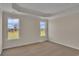 Bedroom with tray ceiling and natural light at 1534 Breakwater Dr., Little River, SC 29566