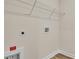 Laundry room with a shelf, hookups and vinyl floor at 1534 Breakwater Dr., Little River, SC 29566