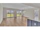 Open concept living room with backyard views and sliding doors that lead to the patio at 1534 Breakwater Dr., Little River, SC 29566