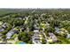 An aerial view shows a neighborhood with tree lined streets and varied home styles at 1718 26Th Ave. N, North Myrtle Beach, SC 29582