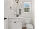 Bathroom with modern fixtures, vanity, toilet, and natural lighting at 1718 26Th Ave. N, North Myrtle Beach, SC 29582