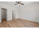 Bedroom with hardwood floors, a ceiling fan, closet, and a bathroom at 1718 26Th Ave. N, North Myrtle Beach, SC 29582