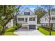 Charming two-story coastal home with a driveway and a garage underneath the main level at 1718 26Th Ave. N, North Myrtle Beach, SC 29582