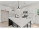 Modern kitchen with stainless steel appliances, a spacious island, and pendant lighting at 1718 26Th Ave. N, North Myrtle Beach, SC 29582