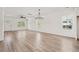 Spacious living room with bright lighting, hardwood floors, and views of the front yard at 1718 26Th Ave. N, North Myrtle Beach, SC 29582