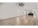 Large living room with an open floor plan, wood-look floors, and plenty of natural light at 1718 26Th Ave. N, North Myrtle Beach, SC 29582
