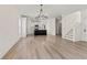 Open-concept living area with a kitchen island, hardwood floors, and natural light at 1718 26Th Ave. N, North Myrtle Beach, SC 29582