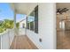 Cozy porch showcasing wood flooring, and a view into the bright and open living space at 1718 26Th Ave. N, North Myrtle Beach, SC 29582