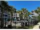 Community pool area with palm trees and seating at 181 Ella Kinley Circle # 305, Myrtle Beach, SC 29588
