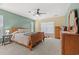 A traditional bedroom with a ceiling fan, carpeted floor, and neutral decor at 276 Whipple Run Loop, Myrtle Beach, SC 29588