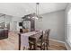 Dining room featuring a dark wood table, modern light fixture, and open layout at 276 Whipple Run Loop, Myrtle Beach, SC 29588