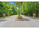 Community entrance flanked by stone signs and lush trees for a welcoming feel at 276 Whipple Run Loop, Myrtle Beach, SC 29588