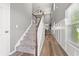 Inviting entryway features hardwood floors, staircase to second level, and natural light at 276 Whipple Run Loop, Myrtle Beach, SC 29588