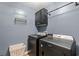 Laundry room features black front load washer and dryer and hanging rack at 276 Whipple Run Loop, Myrtle Beach, SC 29588