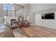 A cozy living room with high ceilings, comfortable seating, and hardwood floors at 276 Whipple Run Loop, Myrtle Beach, SC 29588