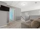 Cozy loft area with neutral walls, plush carpet, and a comfortable sofa at 276 Whipple Run Loop, Myrtle Beach, SC 29588